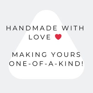 May include: White graphic with the text "HANDMADE WITH LOVE" and a red heart, followed by "MAKING YOURS ONE-OF-A-KIND!" on a light gray background. The text is in a clean, sans-serif font.