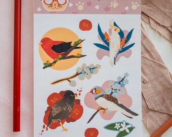May include: A sheet of stickers featuring colorful illustrations of birds, flowers, and foliage. The stickers include a red bird, a white cockatiel, and a bird with brown and white markings. The brand name "Catnap & Co." is at the top.