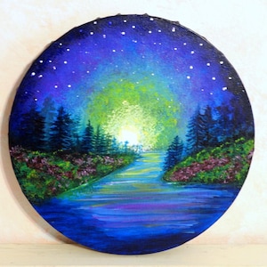 May include: A round painting depicts a nighttime landscape with a river and trees. The sky transitions from dark blue to light green, with white stars. The river reflects the colors of the sky and the trees are dark green.