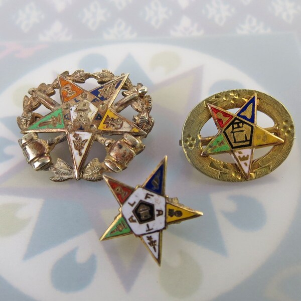 Lot of three enamel Order of Eastern Star masonic enbken pins - one is 10k solid gold and two are gold filled (one as is)