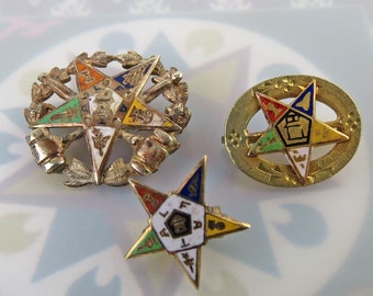 Lot of three enamel Order of Eastern Star masonic enbken pins - one is 10k solid gold and two are gold filled (one as is)