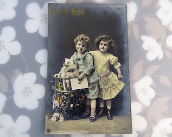 Antique French children with dog 'Vive St. Marie' ( Long live St. Mary ) - hand tinted RPPC real photo postcard postmarked 1924