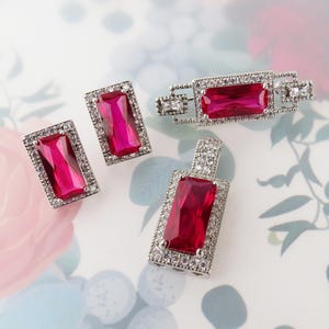 Vibrant red synthetic ruby cz halo brooch earrings and pendant white gold plated set