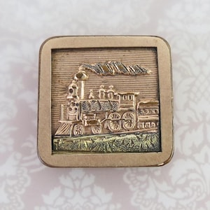 May include: A handmade, wooden cutting board with a natural wood grain. The board features a juice groove and a handle. Dimensions are approximately 18 inches long, 12 inches wide, and 1 inch thick.