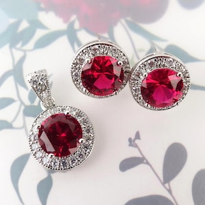 Vibrant red synthetic ruby cz halo stud earrings and pendant white gold plated set