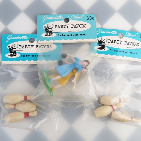 Vintage bowling themed cake topper decorations with wood bowling pins and plastic lady bowlers in unopened packages