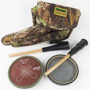 May include: A set of three ceramic mugs with a speckled, matte finish. The mugs are in shades of cream, light gray, and dark gray. Each mug has a simple, minimalist design and a rounded handle.