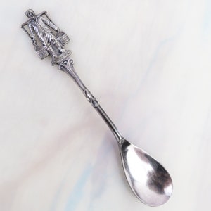 Vintage Dutch Holland demitasse souvenir condiment spoon with man carrying water - 4 3/4 inches