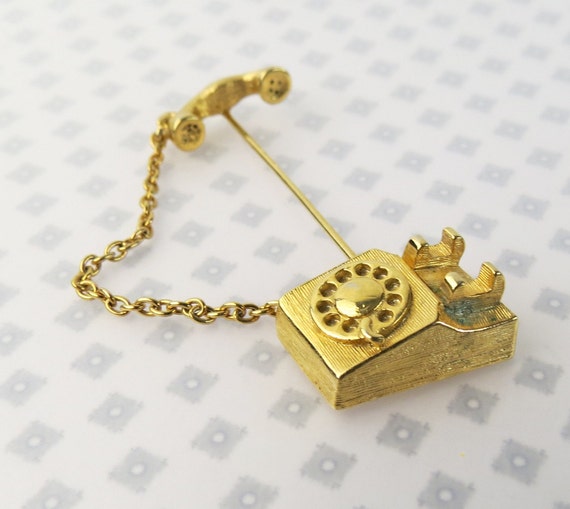 Vintage Avon telephone handset stick or tie pin wi