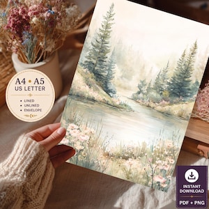 May include: A digital stationery sheet featuring a watercolour landscape of a calm river flowing through a forest with tall pine trees and soft pink wildflowers in the foreground. The text on the circular overlay reads A4, A5, US LETTER, LINED, UNLINED, ENVELOPE.