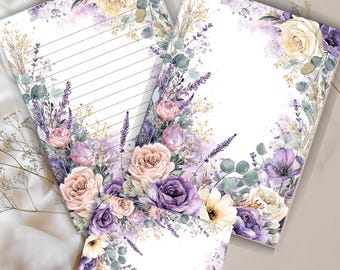 May include: Stationery set featuring floral designs. The set includes lined and unlined paper, and a small card. The floral arrangement includes roses, lavender, and other flowers in shades of purple, pink, and cream. The paper has a watercolor effect.
