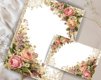 May include: A set of stationery featuring a floral design with pink and peach roses, purple flowers, and green leaves. The stationery has a gold filigree border. The set includes a large sheet and a smaller card.