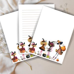 May include: White stationery set featuring illustrations of whimsical witches in hats and dresses, carrying pumpkins and cauldrons. The set includes lined and blank sheets, perfect for Halloween-themed notes and letters.