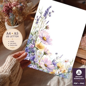 May include: A stationery sheet featuring a watercolour illustration of lavender, cosmos, and wildflowers in shades of purple, pink, and yellow. The text on the sheet reads A4, A5, US LETTER, LINED, UNLINED, ENVELOPE, and INSTANT DOWNLOAD PDF + PNG.