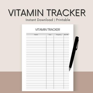 May include: A white printable vitamin tracker with the title "Vitamin Tracker" in a bold, dark font. The tracker includes columns for vitamin, dose, frequency, and AM/PM. A black pen rests on the right side of the page. The text "Instant Download | Printable" is above the title.