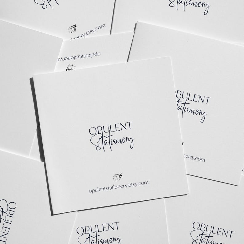 multiple white business cards or envelopes with the text "OPULENT Stationery" printed on them.