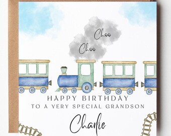 May include: A square greeting card featuring a watercolor illustration of a blue and green train with gray smoke clouds above. The text reads "Choo Choo", "HAPPY BIRTHDAY TO A VERY SPECIAL GRANDSON", and the name "Charlie" in black script.