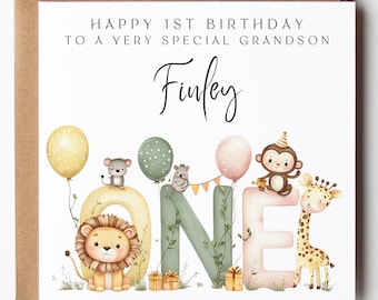 May include: A birthday card with a brown border. The card reads "HAPPY 1ST BIRTHDAY TO A VERY SPECIAL GRANDSON Finley". The word "ONE" is decorated with a lion, monkey, giraffe, and balloons.