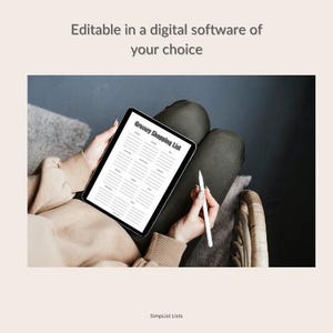 May include: A black tablet displaying a "Grocery Shopping List" template, held by a person. A white stylus rests in the other hand. The text "Editable in a digital software of your choice" is at the top. The bottom text reads "Simplist Lists".