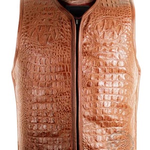 May include: A brown leather vest with a crocodile skin texture. The vest has a zip closure and a round collar. The vest is sleeveless and has a classic design. The leather has a glossy finish.