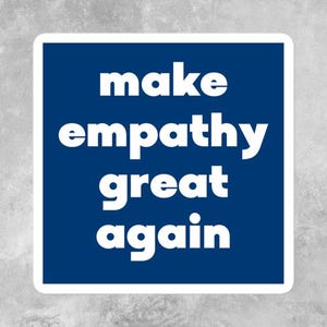 May include: A blue square sticker with white text that reads "make empathy great again".