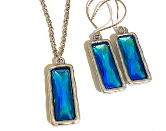 Reflective pools of Deep Blue Rhinestones in Silver Pendant and Earrings Set