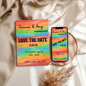 May include: A save-the-date card and a smartphone show a rainbow design with the text "Gemma & Amy are getting hitched." The card and phone include the date, time, and location of the event.