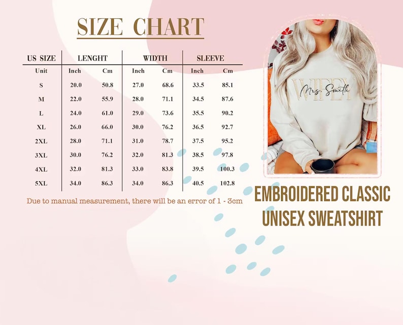 May include: A size chart for an embroidered classic unisex sweatshirt, with measurements in inches and centimeters. The chart includes sizes S to 5XL, detailing length, width, and sleeve measurements. The image also shows a cream-colored sweatshirt with the name "Mrs. Smith" embroidered on it.