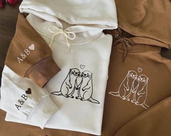 Otter Love Matching Couple Embroidered Hoodie With Personalized Sleeve Initials - Cute Anniversary Sweatshirt Gift For Him And Her
