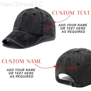 May include: A black, distressed baseball cap with a curved brim. The cap features text that reads "CUSTOM TEXT" and "CUSTOM NAME", with instructions to add a name or text. The cap is designed for customization.