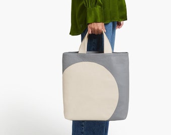 Borsa a mano in pelle beige e grigia: una fusione di stile e praticità