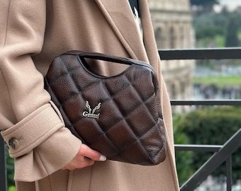 Handcrafted Brown Leather Handbag with Metallic Clasp - Elegant and Versatile