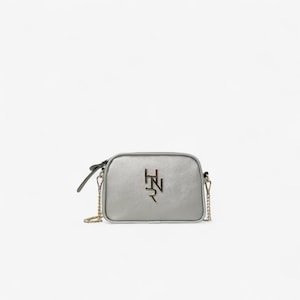 Silver Oval Crossbody Bag With Gold Chain And Embossed Texture