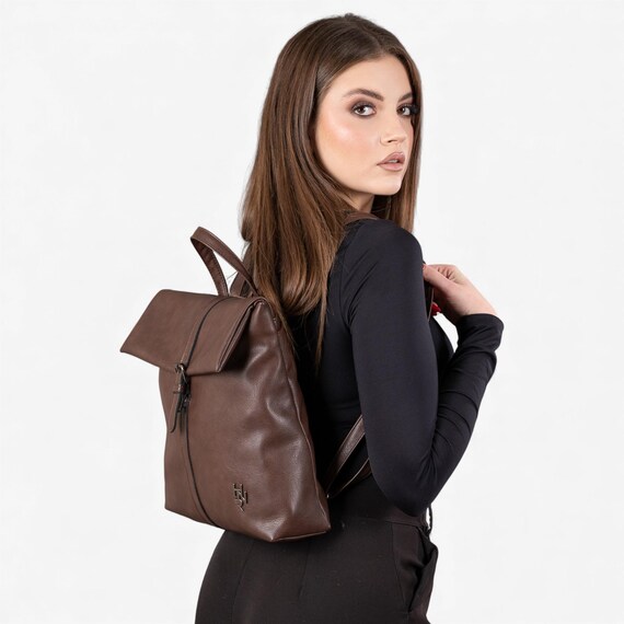 brown faux leather backpack top flap snap closure Brown Flap-top Backpack in Synthetic Leather