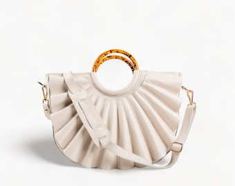 Elegant Beige Leather Bag with Bone Rings Handles and Shoulder Strap