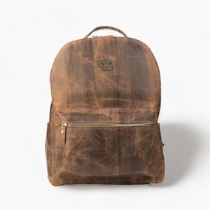 Mochila de piel marrón desgastada con compartimento para portátil