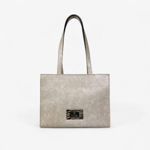 Silver Crossbody Bag With Embossed Texture And Chain Detail