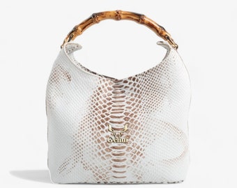 White Leather Handbag with Bone-Style Plastic Handle - Luxury and Functionality Combined