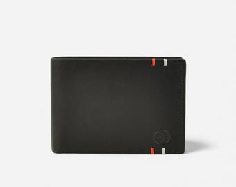 May include: Black leather wallet with red and white accent stripes. The wallet has a small emblem on the lower right corner. The wallet is rectangular and has a bi-fold design.