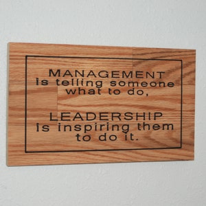 MANAGEMENT is telling someone what to do, LEADERSHIP is inspiring them to do it. - Hand painted, carved wood plaque - 23073