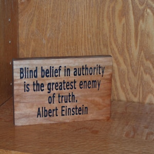 Blind belief in authority is the greatest enemy of truth. Albert Einstein - Hand painted, carved wood plaque - 23263