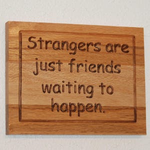 Strangers are just friends waiting to happen.  Reclaimed hardwood carved wood plaque - 23183