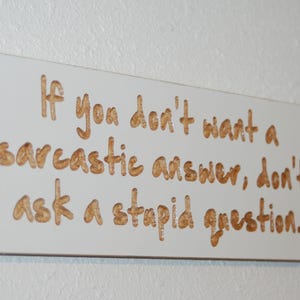 If you don't want a sarcastic answer, don't ask a stupid question. - carved wood plaque - 26232