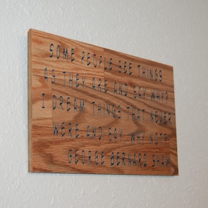 May include: A set of three ceramic mugs with a speckled, matte finish. The mugs are in shades of cream, light gray, and dark gray. Each mug has a simple, minimalist design and a rounded handle. The mugs are stacked on top of each other.