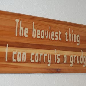 The heaviest thing I can carry is a grudge. - Hand painted wooden plaque - 10016