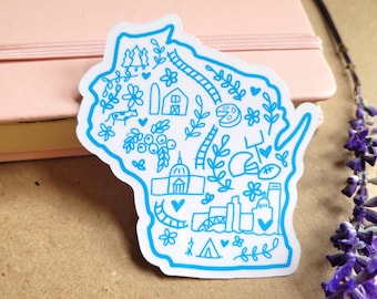 May include: A blue and white sticker of the state of Wisconsin with various illustrations of things associated with the state, including a farm, a cheese wedge, a football, a tent, and a city skyline.