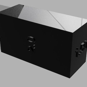 May include: A black rectangular block with the embossed letters "ON" on one side and "140" on another. The block has a reflective top surface and casts a shadow on a grey background.
