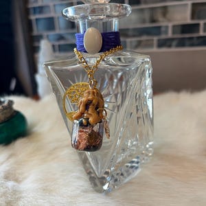 Vintage Lead Crystal Perfume Bottle with mini spell vial and tree of life charm