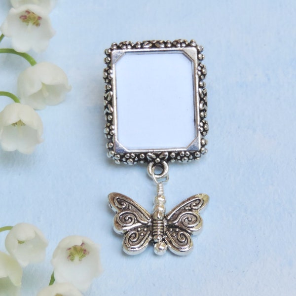 Memorial photo lapel pin with a butterfly and small picture frame.