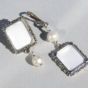 A lapel pin and a wedding bouquet charm set for the bride and groom. Both have a small picture frame in antique silver tones and a freshwater pearl. You can add the photos yourself or chose for me to do them. Other beads & colors available- just ask.